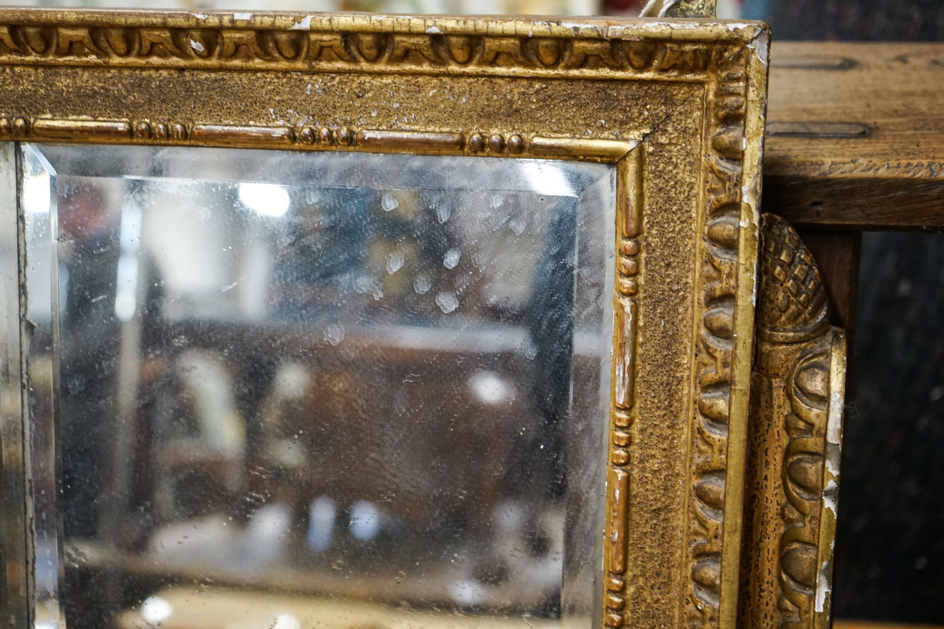 A 19th century giltwood and gesso triple plate overmantel mirror, width 164cm, height 49cm